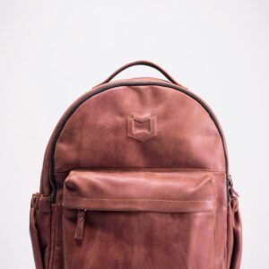 brown leather backpack on white background